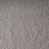 zijde met kleine krulletjes geborduurd