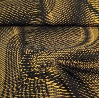Soepele viscose tricot met grafisch design in zwart met mosterd geel