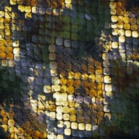 viscose tricot  met geel, oker, terra en groen slangenprint