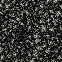 zwart viscose met klein wit bloemetje en iets oranje