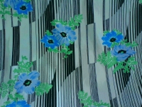 polyester tricot : speelse zwarte streep met aqua bloem 